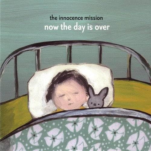 Album cover: child with bunny in bed, painted style.