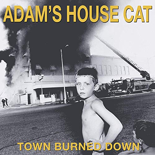 CD cover: boy in front of burning building, firefighters present.