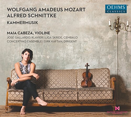 CD cover: violinist on a couch with a violin and candelabra.