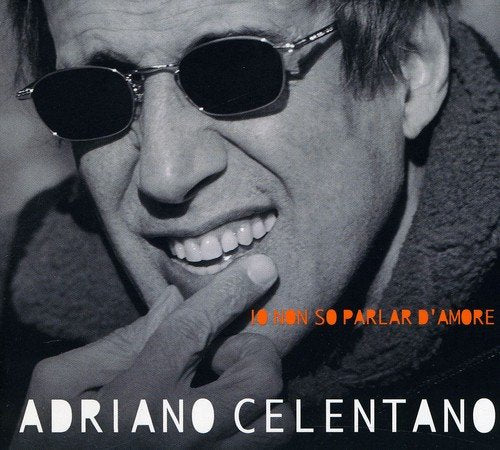 Adriano Celentano album cover: close-up of smiling man in sunglasses.
