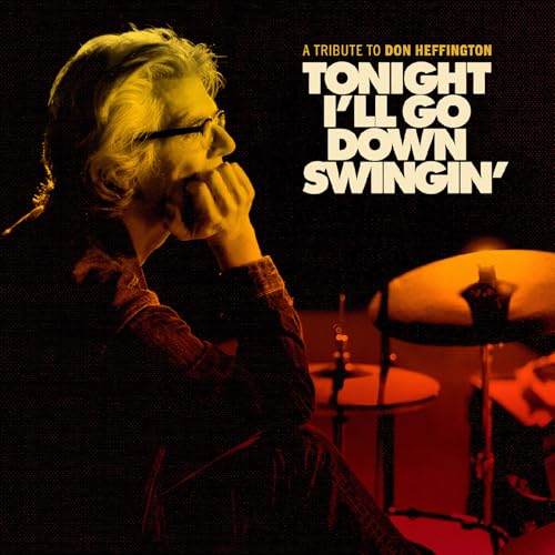 Album cover featuring a man with glasses and a drum kit in background.