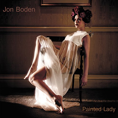 Album cover: woman in white dress with flowers in her hair.