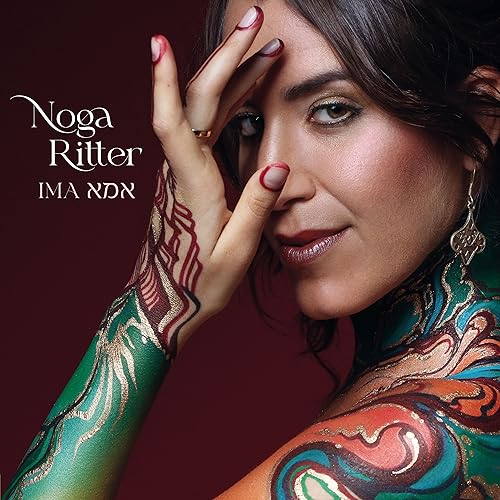 Close-up portrait of Noga Ritter with intricate henna body art.