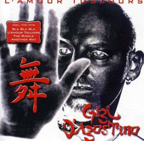 CD cover featuring Gigi D'Agostino with red text and hand imagery.