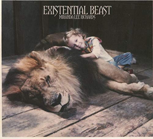CD cover: young girl embracing a large, lying-down lion.