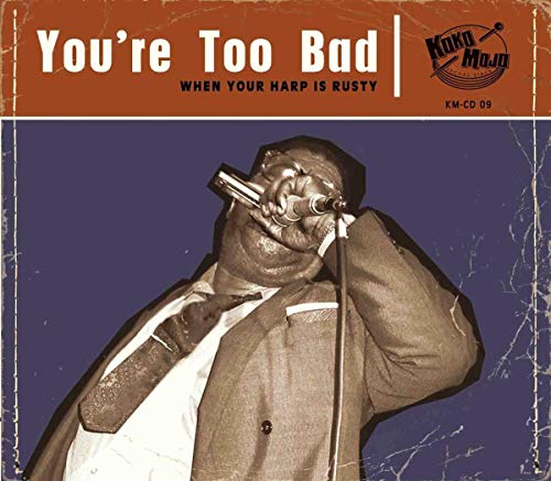 CD cover: blues musician singing into a vintage microphone.