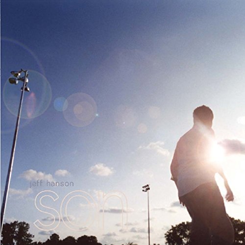 CD cover: man silhouetted against a bright, sunny sky with light posts.