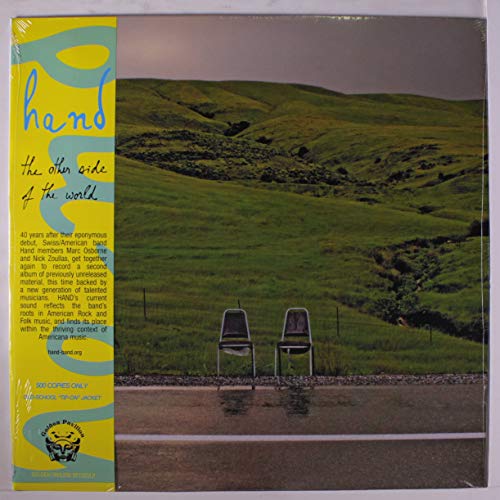 Vinyl record cover: yellow, landscape with green hills and two chairs.