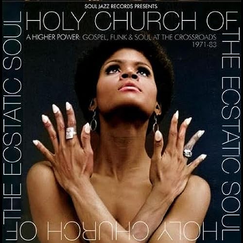 Vinyl album cover featuring a Black woman looking upwards with raised hands.