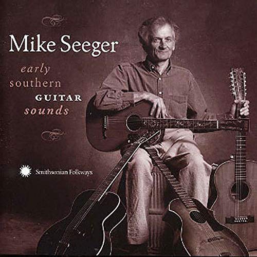 Mike Seeger seated with three guitars on the CD cover.