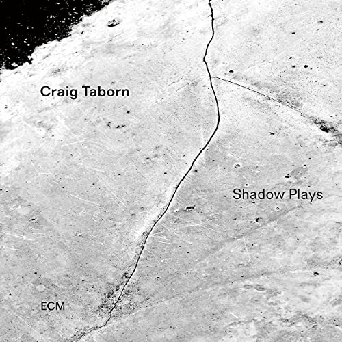 Black and white CD cover for Craig Taborn’s “Shadow Plays” with a cracked texture.