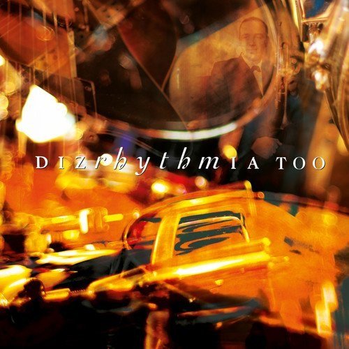 CD cover for Dizrhythmia - Too, featuring blurred city lights and a portrait.