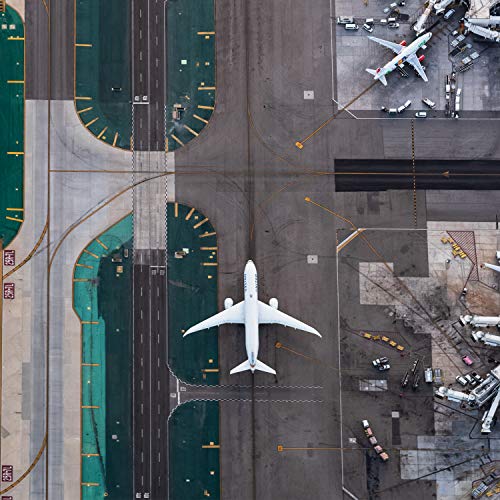 CD cover with aerial view of an airport and airplanes.