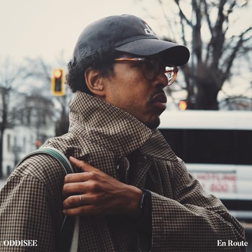 Oddisee in a cap and glasses, looking right, with album title.