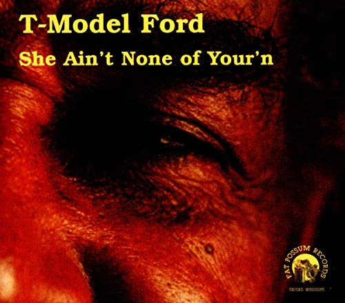 Close-up of T-Model Ford’s face on the album cover “She Ain’t None of Your’n.”