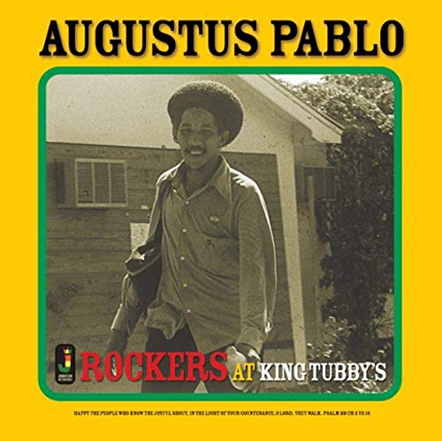 Augustus Pablo album cover featuring a smiling man in front of a house.