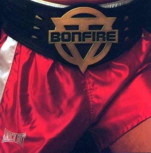Boxing shorts with a gold "Bonfire" logo on a black belt.