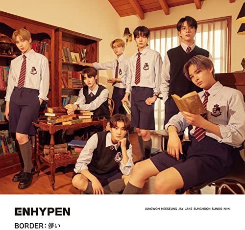 Seven young men in school uniforms pose in a warmly lit study.