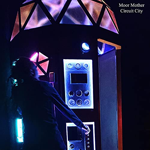 Moor Mother’s “Circuit City” album cover: a person near a glowing arcade cabinet.
