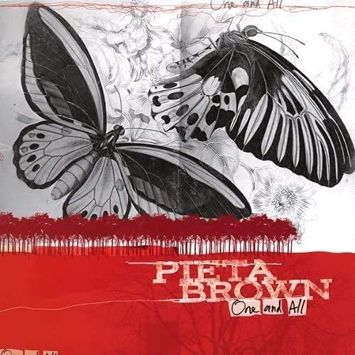 Vinyl record cover with butterflies and a silhouetted tree line.