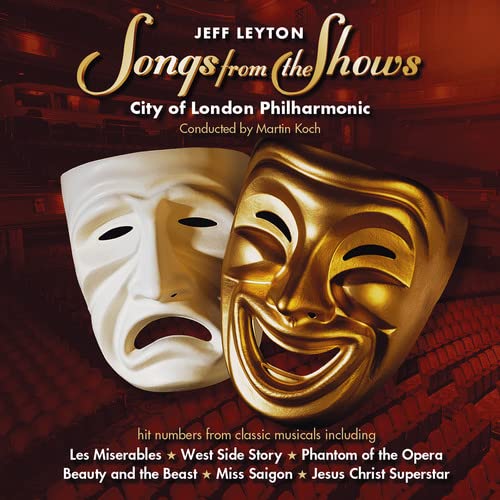 CD cover featuring a white and gold theatrical mask against a theater backdrop.