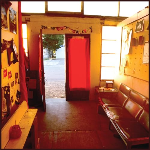 Record album cover depicting an open doorway to a sunlit street.