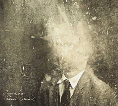 Sepia-toned portrait of a man with a blurred, textured effect.