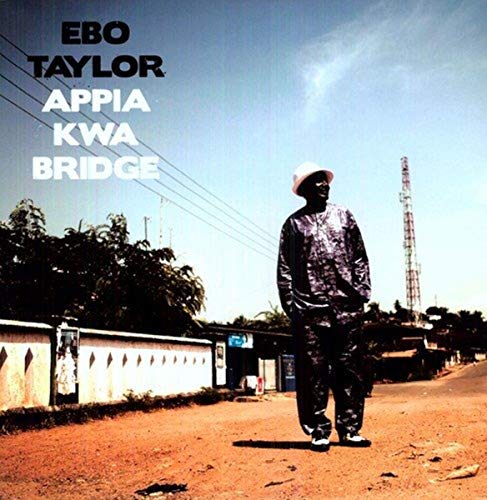 CD cover: Man in hat walking down a rural road.