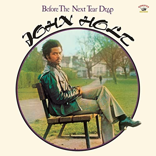 John Holt album cover: man sitting on a bench in a park.