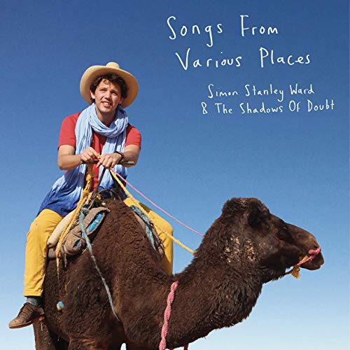 Album cover of a man in a hat riding a camel under blue sky.