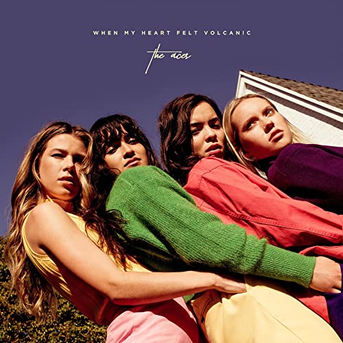 Album cover featuring four women in colorful clothing against a purple background.