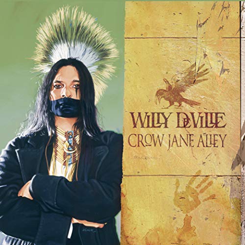 CD cover featuring Willy DeVille in a suit with Native American imagery.