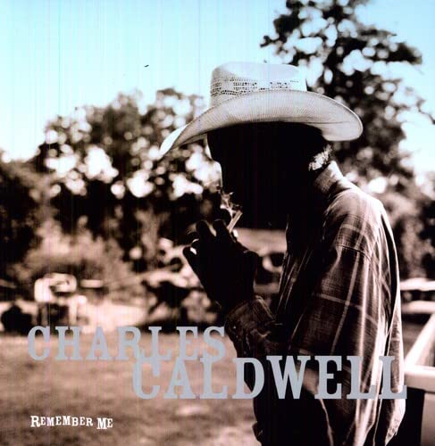 Charles Caldwell album cover: man in hat, looking down, trees background.