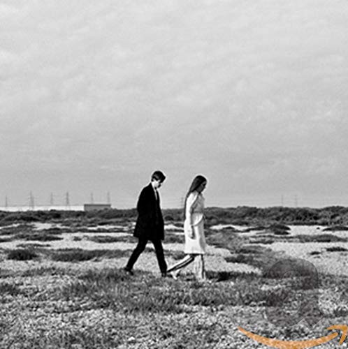 Black and white album cover featuring a walking couple in a field.