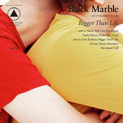 Vinyl record cover featuring a person embracing another in yellow.