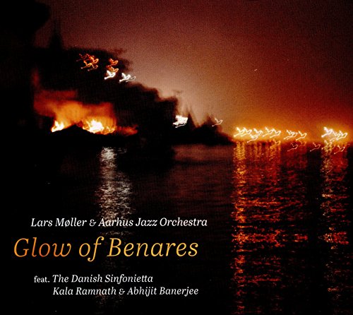 CD cover: nighttime river scene with lights and a fiery glow.