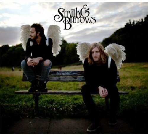Two men with feathered wings sit on a park bench.