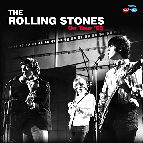 Black and white photo of The Rolling Stones performing on stage in 1965.