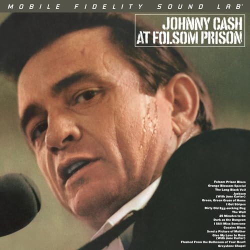 Johnny Cash album cover, “At Folsom Prison,” close-up portrait.