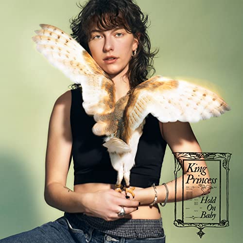 King Princess with a barn owl perched on her arm, album cover.