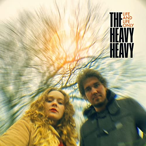 Album cover featuring two people and blurred, radiating tree branches.
