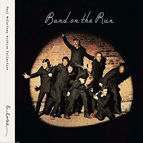 Paul McCartney's "Band on the Run" album cover with figures in dark suits.