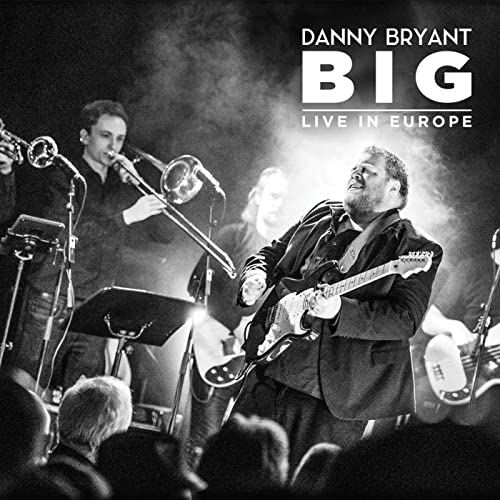 Danny Bryant and band performing live on stage, black and white image.