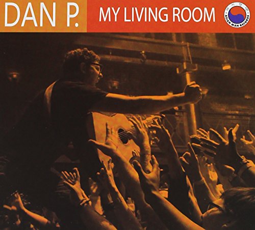 CD cover for “My Living Room” featuring a musician with a crowd.