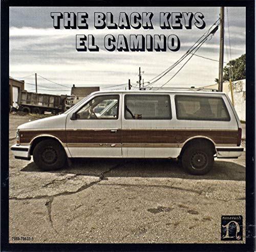 “El Camino” album cover: a wood-paneled van in a dusty lot.