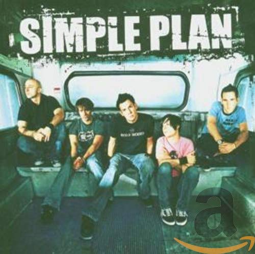 Simple Plan band members seated in a truck bed, album cover.