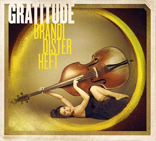 CD cover: woman with double bass in a golden circular frame.