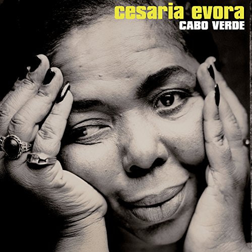 Close-up portrait of Cesária Évora, a woman with dark hair and a gentle smile.