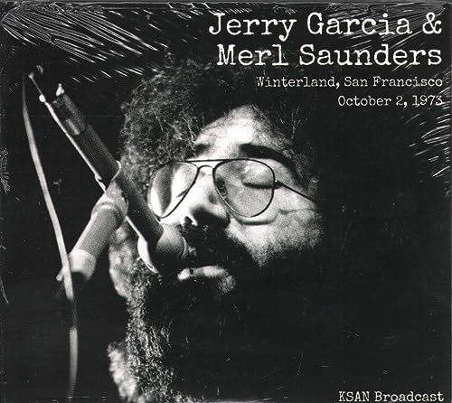 Black and white photo of Jerry Garcia singing into a microphone.