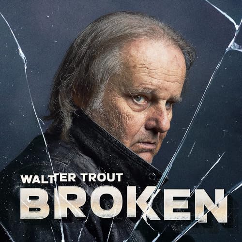 Portrait of Walter Trout with a shattered glass effect overlay on a dark background.